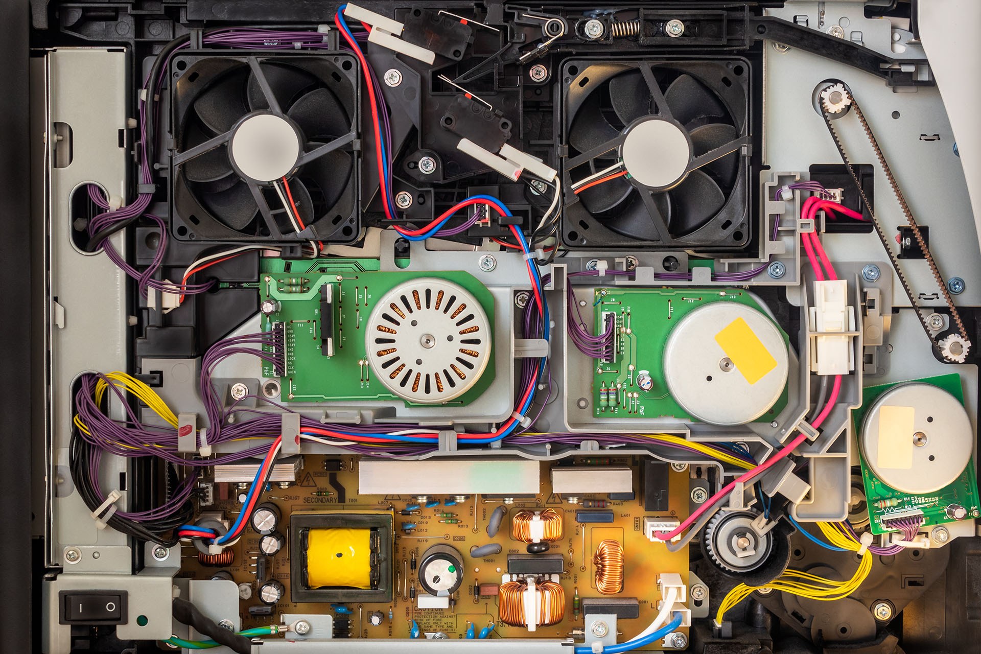 Close-up of internal printer components during a diagnostic repair